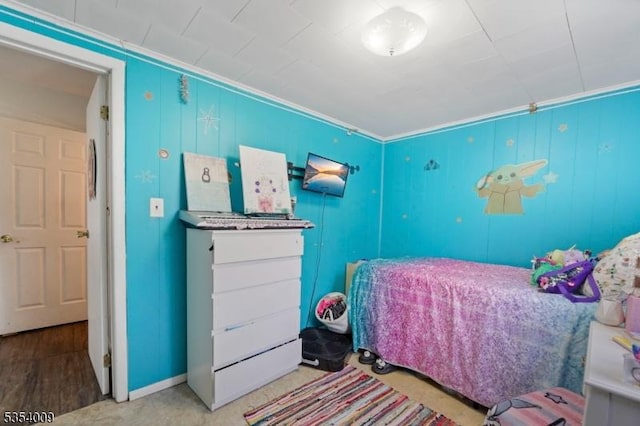 bedroom with baseboards and ornamental molding