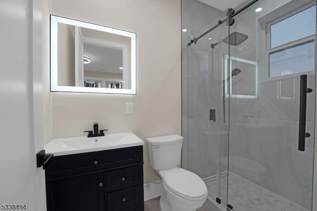 full bath featuring a shower stall, toilet, and vanity