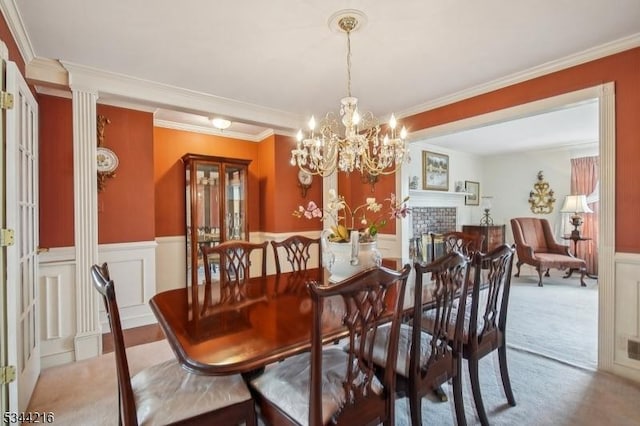 11 Mountain View Dr, Chester Twp, NJ 07930 - carpeted dining room featuring a notable chandelier, wainscoting, crown molding, and a decorative wall