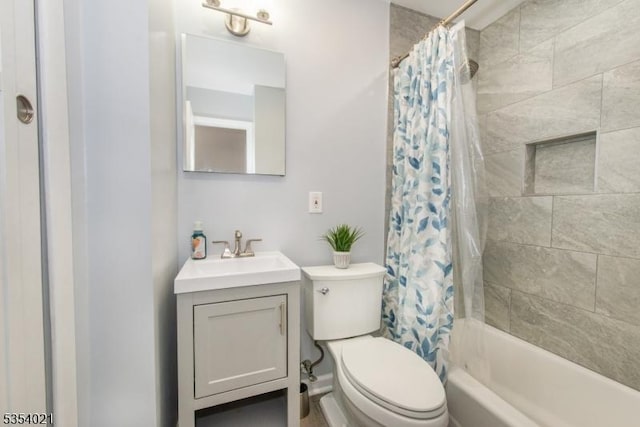 bathroom with vanity, toilet, and shower / bath combination with curtain