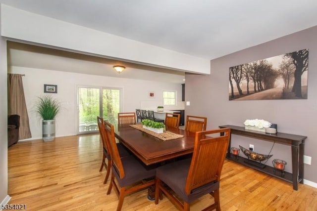 dining area featuring light wood-style floors