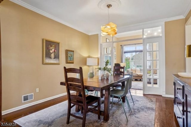 dining space with baseboards, dark wood-style flooring, and visible vents