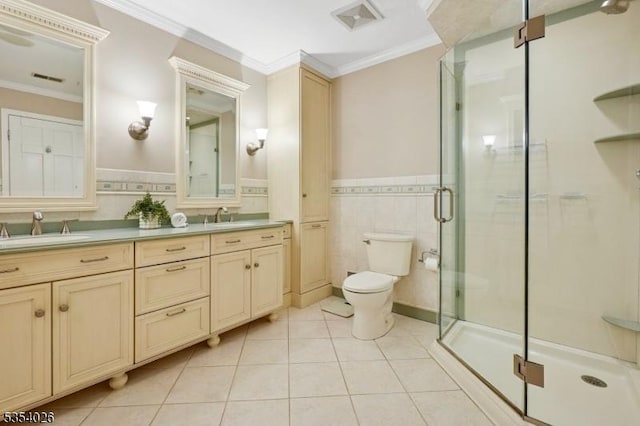 full bath with a sink, tile patterned floors, ornamental molding, and toilet