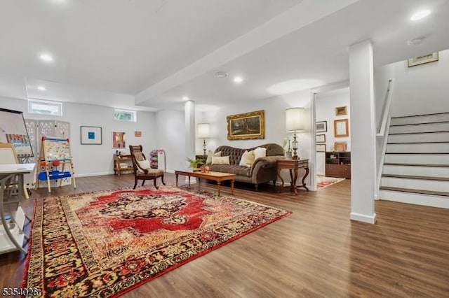 living room with recessed lighting, baseboards, stairs, and wood finished floors