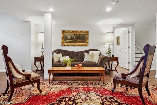 sitting room featuring stairway, recessed lighting, and wood finished floors