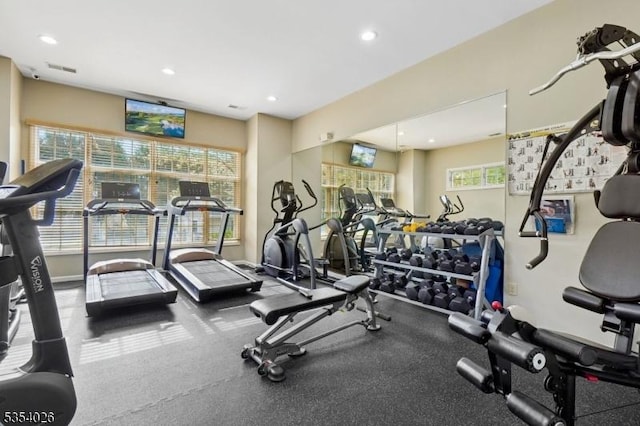 gym with recessed lighting, visible vents, and plenty of natural light
