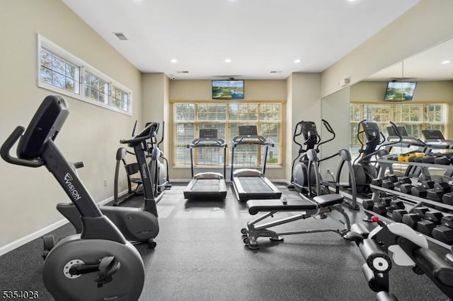 workout area with baseboards, recessed lighting, and visible vents