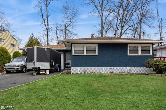 221 Douglas Rd, Roselle Boro, NJ 07203 - view of front facade featuring a sunroom, a front lawn, and a chimney