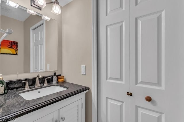 bathroom featuring vanity and visible vents