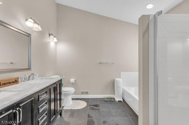full bathroom featuring double vanity, a bath, a sink, baseboards, and toilet