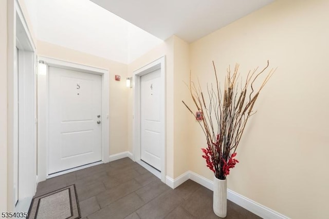 foyer entrance with baseboards