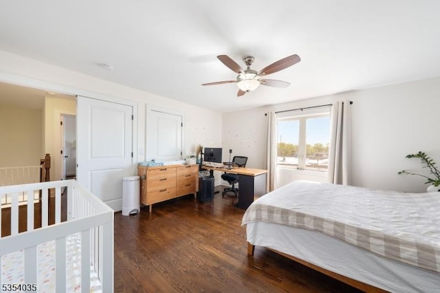bedroom featuring a ceiling fan and dark wood-style floors