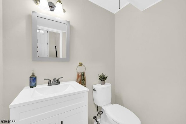 bathroom with toilet and vanity