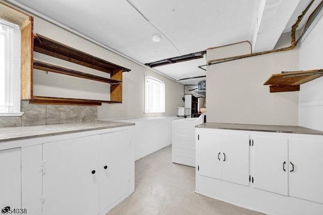 laundry room with light floors and washer / clothes dryer