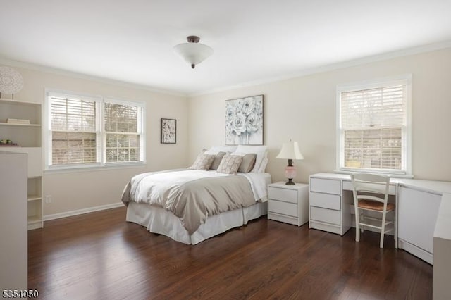 bedroom featuring crown molding, dark wood finished floors, and baseboards