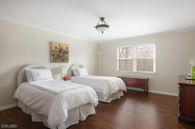 bedroom with crown molding, baseboards, and wood finished floors