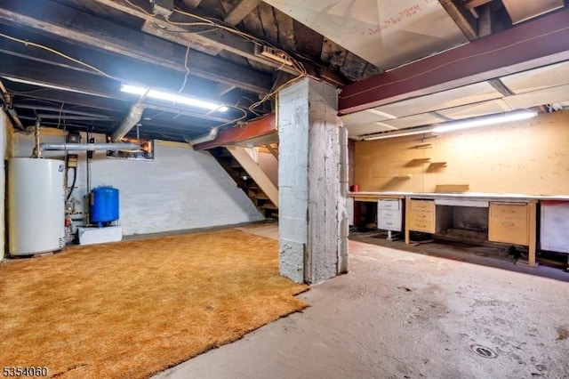 51 Meggins Rd, Rockaway Twp, NJ 07866 - unfinished below grade area featuring water heater, a water pressure tank, and stairs