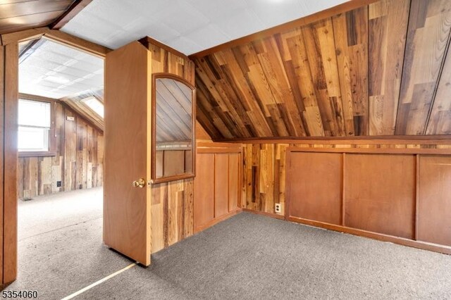 51 Meggins Rd, Rockaway Twp, NJ 07866 - additional living space featuring vaulted ceiling, wooden walls, and carpet flooring