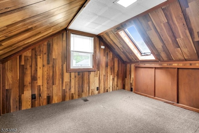 51 Meggins Rd, Rockaway Twp, NJ 07866 - additional living space featuring a skylight, vaulted ceiling, wood walls, and carpet floors