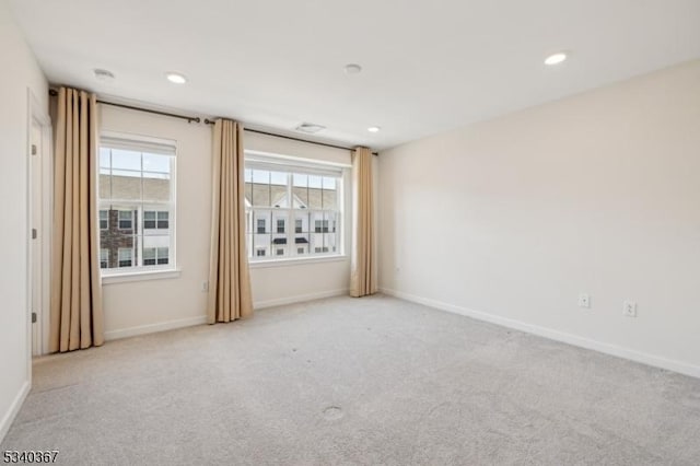 unfurnished room with carpet floors, recessed lighting, and baseboards