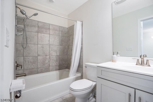bathroom featuring vanity, visible vents, toilet, tile patterned floors, and shower / tub combo