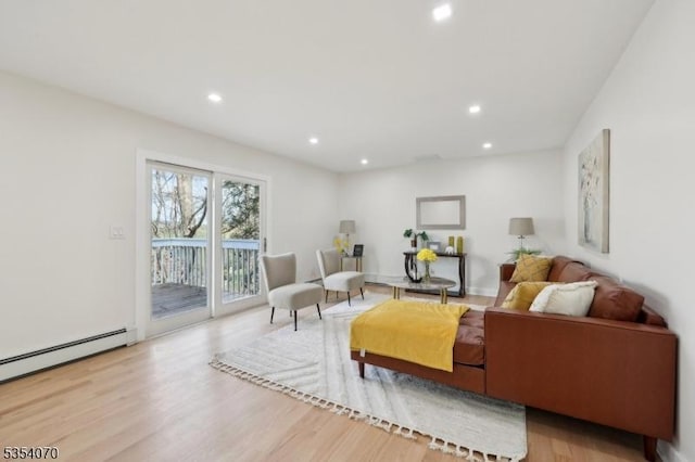 living area featuring recessed lighting, wood finished floors, and baseboard heating