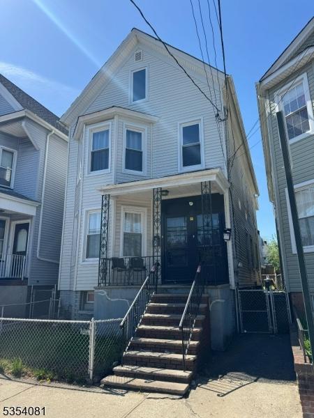 914 S St, Elizabeth City, NJ 07202 - view of front of home with covered porch and fence private yard