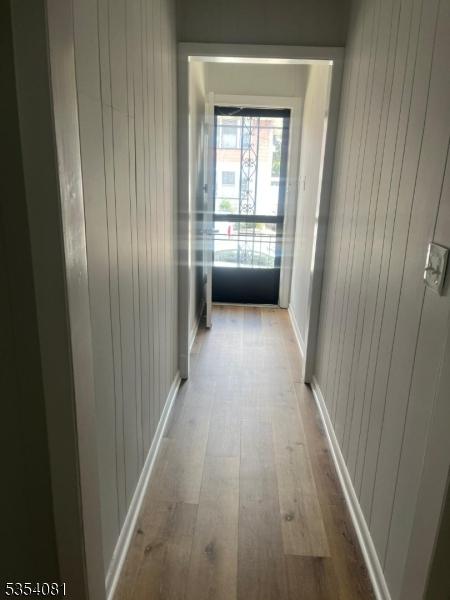 914 S St, Elizabeth City, NJ 07202 - hallway featuring wooden walls and wood finished floors