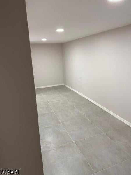 914 S St, Elizabeth City, NJ 07202 - basement with recessed lighting, baseboards, and tile patterned flooring