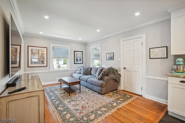 living area with recessed lighting, baseboards, and wood finished floors