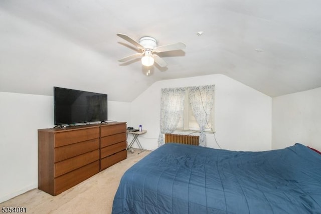 bedroom featuring light colored carpet, a ceiling fan, and vaulted ceiling