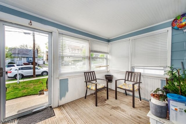 sunroom / solarium featuring a healthy amount of sunlight