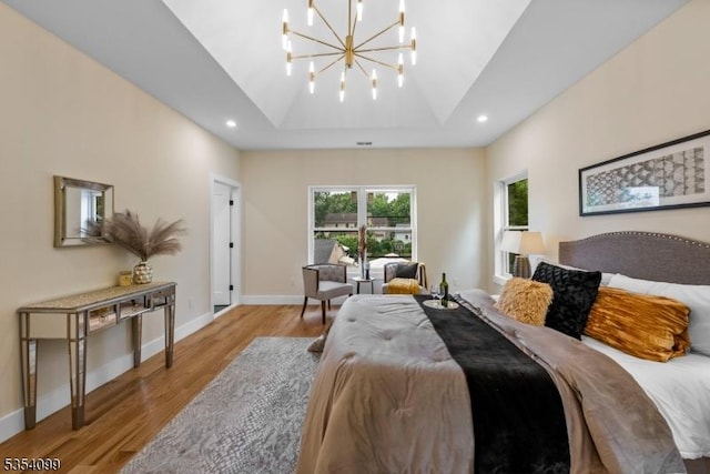bedroom featuring light wood-style floors, a chandelier, baseboards, and recessed lighting