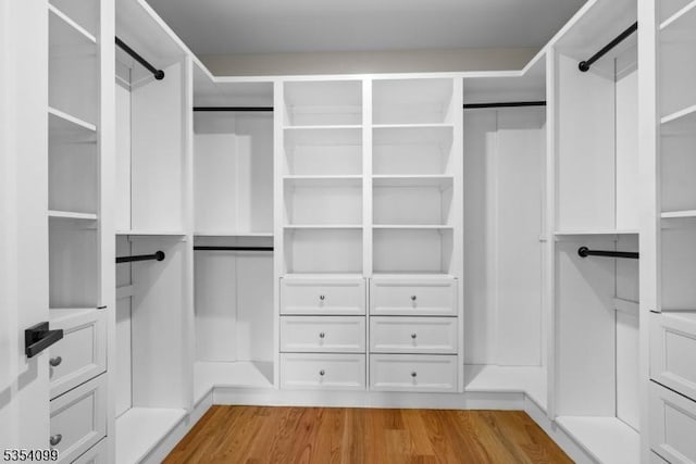 spacious closet with light wood finished floors