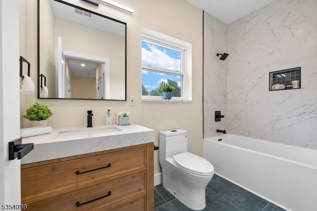 bathroom featuring toilet, vanity, tile patterned flooring, and bathtub / shower combination