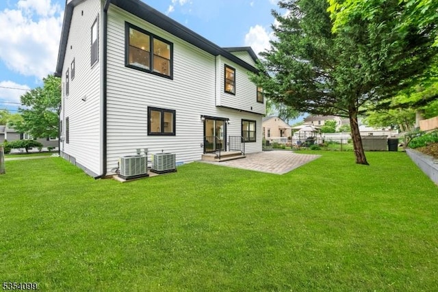back of house featuring central AC and a patio