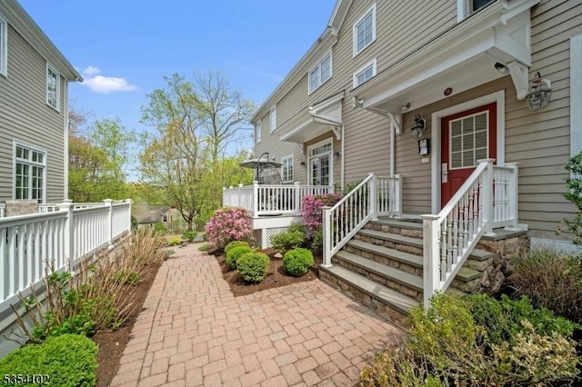 entrance to property with a deck