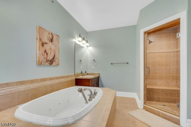 bathroom with tile patterned flooring, vanity, baseboards, a whirlpool tub, and a shower stall