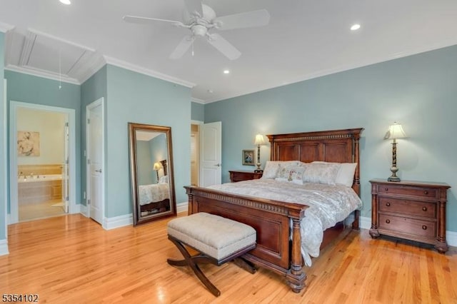 bedroom featuring baseboards, attic access, light wood-style floors, and ornamental molding
