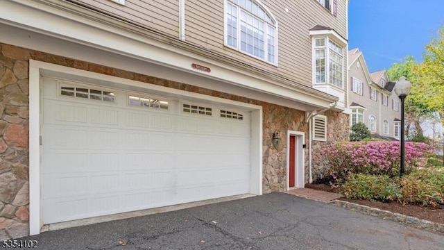 exterior space with aphalt driveway