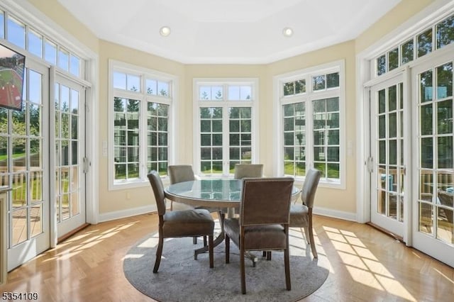 sunroom / solarium featuring french doors, baseboards, and plenty of natural light