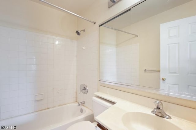 bathroom featuring vanity, toilet, and shower / washtub combination