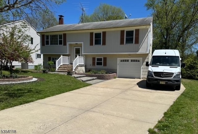 61 Duval St, Bridgewater Twp, NJ 08807 - bi-level home with concrete driveway, a chimney, a front yard, and a garage