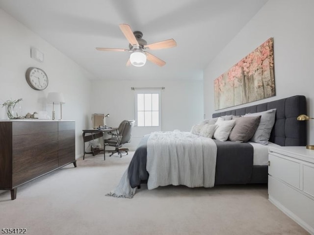 bedroom featuring light colored carpet and ceiling fan
