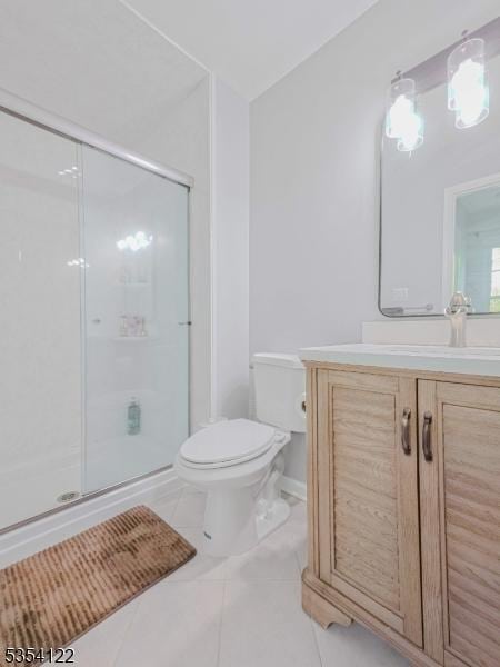 full bathroom with vanity, toilet, baseboards, tile patterned floors, and a stall shower