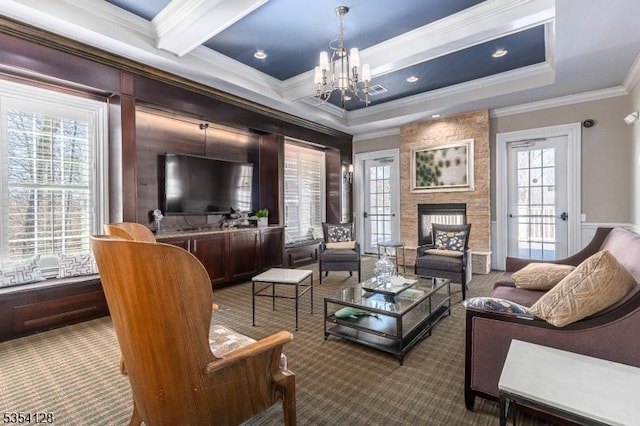 living room with beam ceiling, an inviting chandelier, ornamental molding, coffered ceiling, and carpet flooring