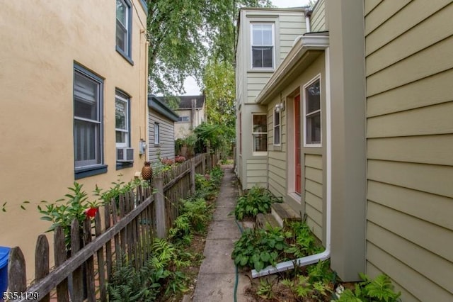 view of property exterior with fence