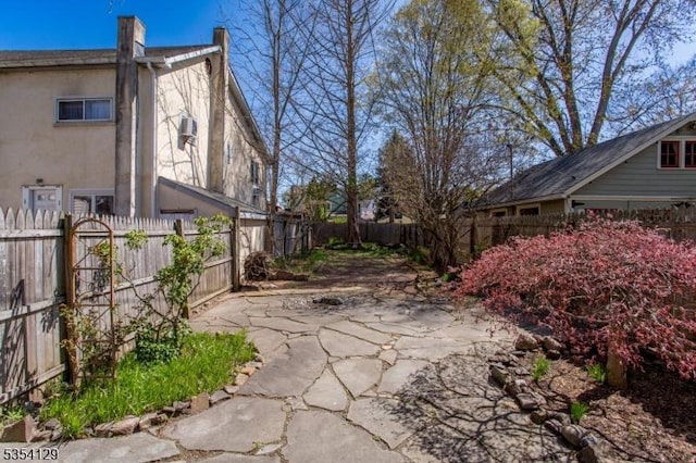 view of home's exterior featuring a fenced backyard, stucco siding, and a patio area