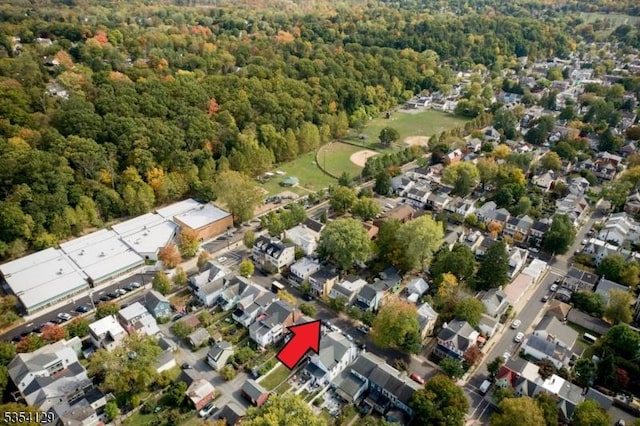 aerial view with a residential view and a wooded view