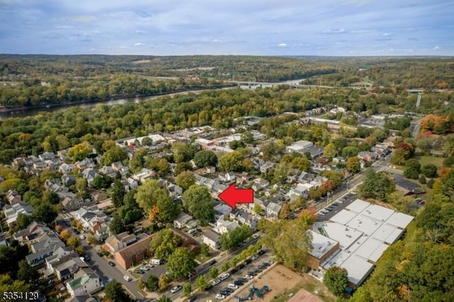 birds eye view of property with a residential view and a forest view